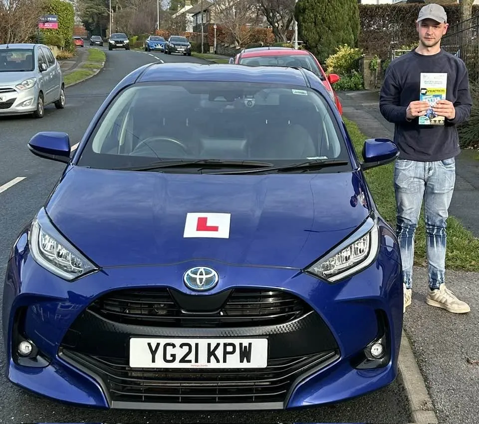 Harry M after passing his driving test first time following an intensive driving course